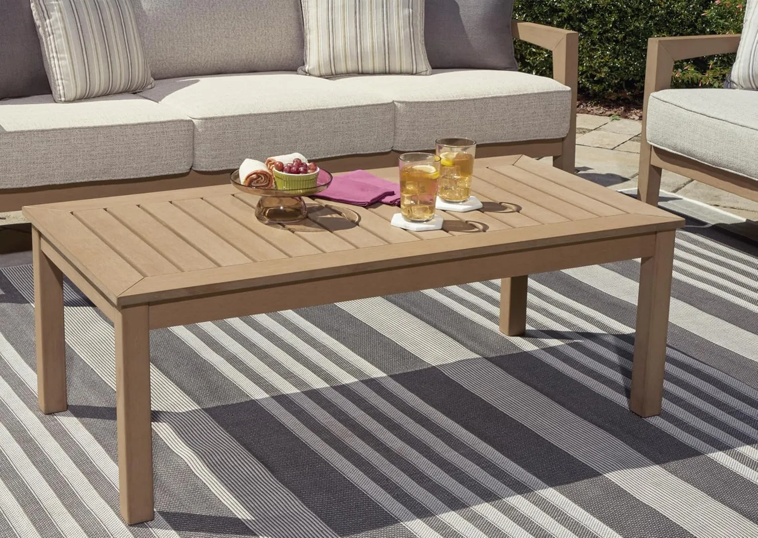 Signature Design by Ashley Hallow Creek Casual UV Resistant Resin Outdoor Coffee Table, Light Brown